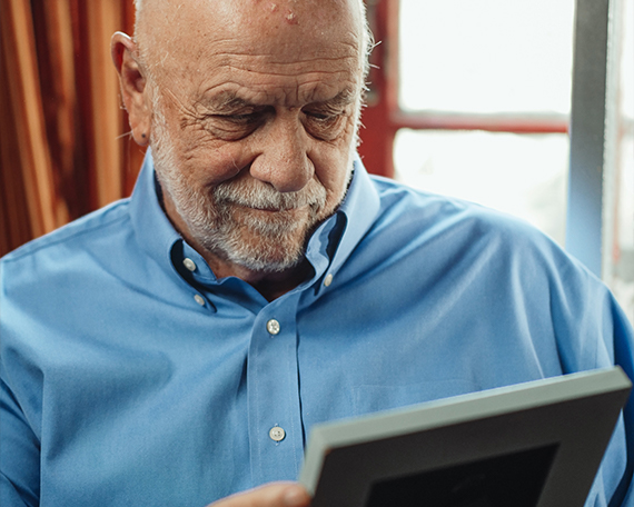 man with photo album
