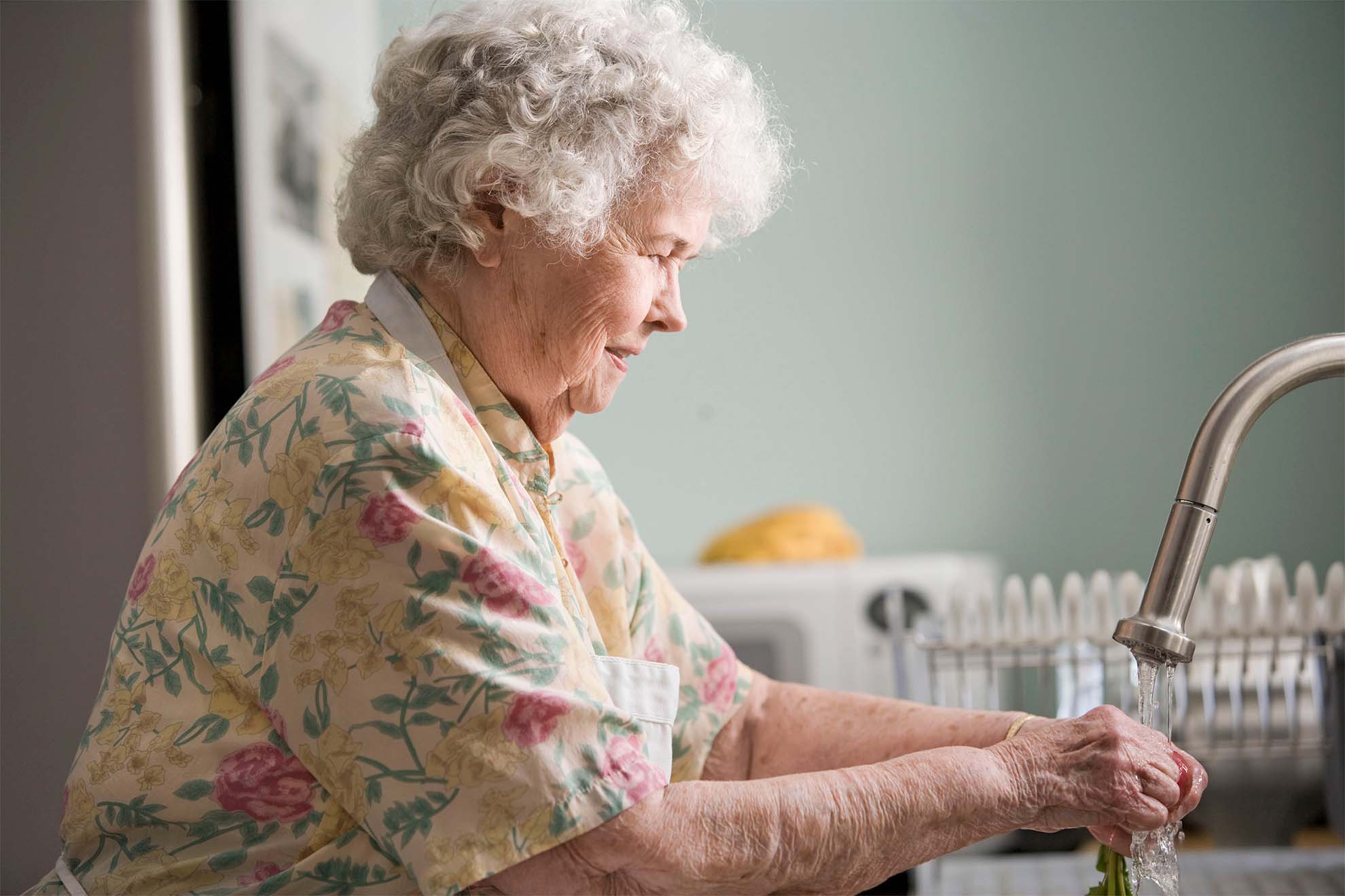 Aspen Court resident in kitchen